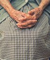 Elderly pair of arms, holding hands 