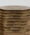 a stack of gold coins on top of each other